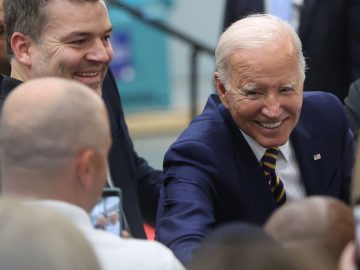President Joe Biden says he will request more funding for a new coronavirus vaccine