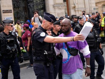 Migrants and homeless people were cleared out of Paris during the Olympics. What does this mean for LA?
