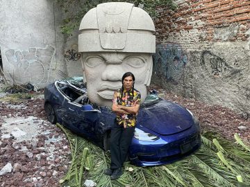Mexican artist leaves a Tesla to crumble under the weight of an Olmec head