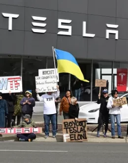 Man drives car into protesters outside a Tesla dealership, nobody hurt, sheriff says