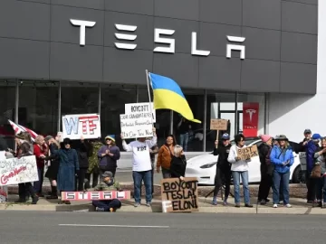 Man drives car into protesters outside a Tesla dealership, nobody hurt, sheriff says