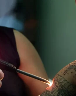 Fearing deportation, thousands seek to erase their tattoos